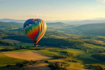 Obraz premium Vibrant hot air balloon soaring over serene tuscan landscape at sunset