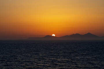 Greek sunsets over the Aegean sea during summer 