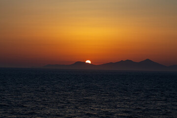 Greek sunsets over the Aegean sea during summer 