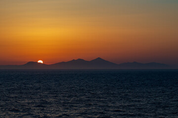 Greek sunsets over the Aegean sea during summer 
