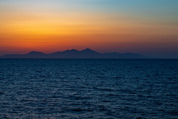 Greek sunsets over the Aegean sea during summer 