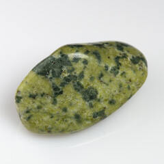 Elegant Polished Serpentine Gemstone with Natural Patterns on White Background