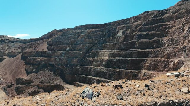 Old open pit mine in desert 