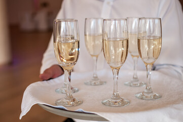 Elegant Champagne Flutes on a Serving Tray - A Subtle Celebration of Bubbles and Class