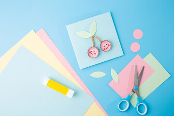 Flat lay of craft materials and tools on pastel background