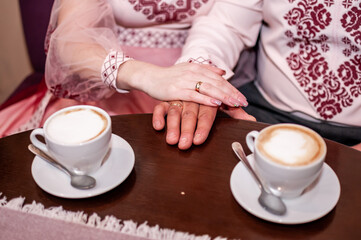 Morning Harmony: An Ethnic Couple Sharing Coffee and Affection