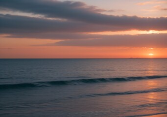 Obraz premium Sunset Over Calm Ocean Waves