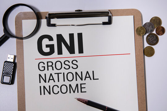 GNI Gross National Income written in a notebook on white table