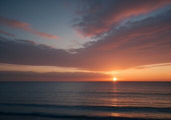 Obraz premium Sunset Over Calm Ocean Waves