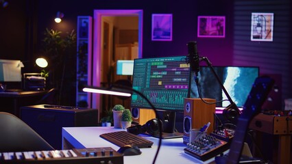 Electronic instruments used for mixing and recording tunes in empty home studio, soundboard...