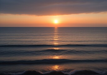 Obraz premium Sunset Over Calm Ocean Waves