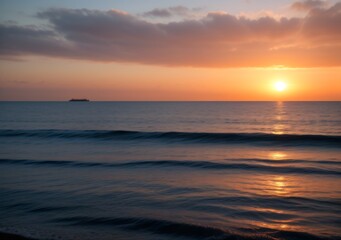 Obraz premium Sunset Over Calm Ocean Waves