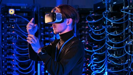 Man using Virtual Reality headset in a server room - Powered by Adobe