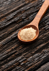 Organic Peruvian maca powder in spoon - Lepidium meyenii