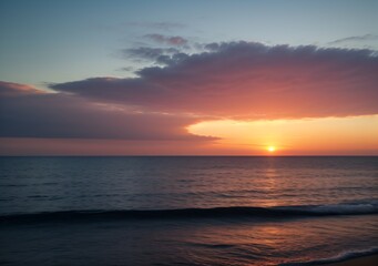 Fototapeta premium Sunset Over Calm Ocean Waves