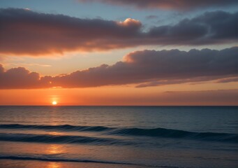 Fototapeta premium Sunset Over Calm Ocean Waves