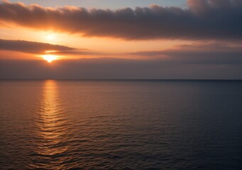 Fototapeta premium Sunset Over Calm Ocean Waves