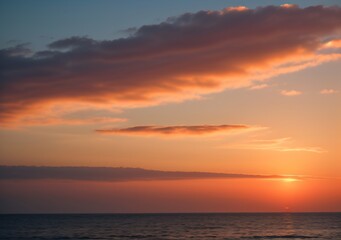 Fototapeta premium Sunset Over Calm Ocean Waves