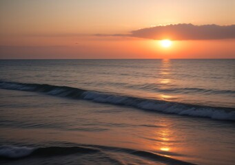 Fototapeta premium Sunset Over Calm Ocean Waves