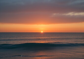 Fototapeta premium Sunset Over Calm Ocean Waves