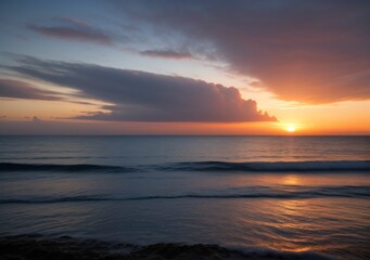 Obraz premium Sunset Over Calm Ocean Waves