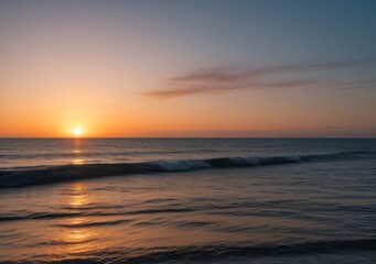 Obraz premium Sunset Over Calm Ocean Waves