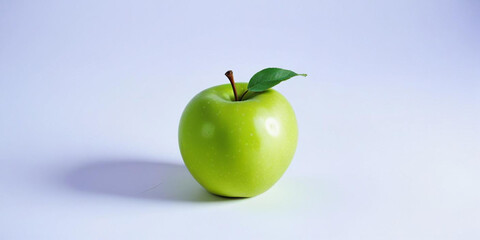 A green apple with a leaf, on a white background