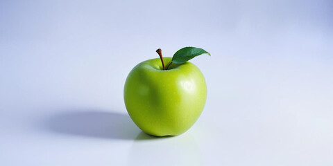 A green apple with a leaf, on a white background