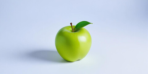 A green apple with a leaf, on a white background