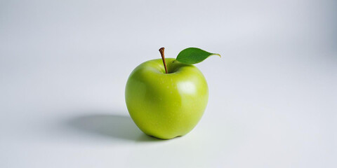 A green apple with a leaf, on a white background