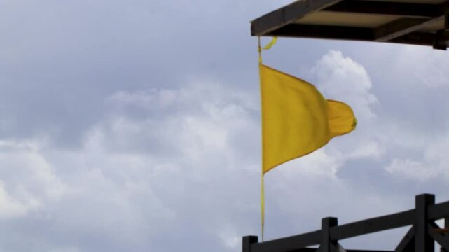 Yellow flag swimming prohibited high waves Playa del Carmen Mexico.