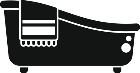 Modern bathtub with a hanging towel evokes a relaxing home spa experience