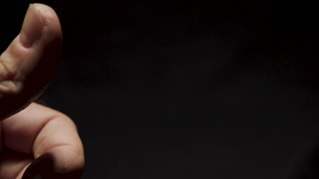 Close-up of US Quarter Being Flicked from Thumb