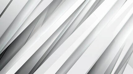 Obraz premium A dynamic abstract design featuring sharp, overlapping white and light gray geometric shapes, creating a sense of depth and movement.