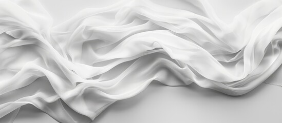 Obraz premium Close Up Of A White Fabric Cloth Flowing On White Background