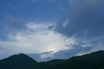 
Mountain silhouette and sunset sky.