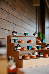 Delicious desserts, Sweet cakes, delicious eclairs, Table candies, mini cakes, Delicious wedding, holiday. Birthday, banquet table,