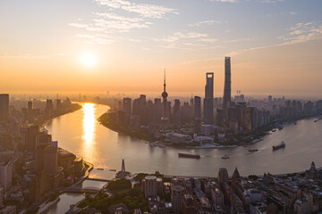 Aerial view of modern city skyline and buildings at sunrise in Shanghai