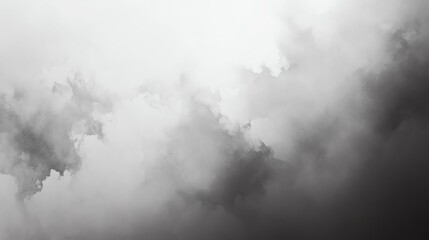 Naklejka premium A captivating blend of grey clouds, evoking a sense of mystery and tranquility in a moody, monochromatic atmosphere.