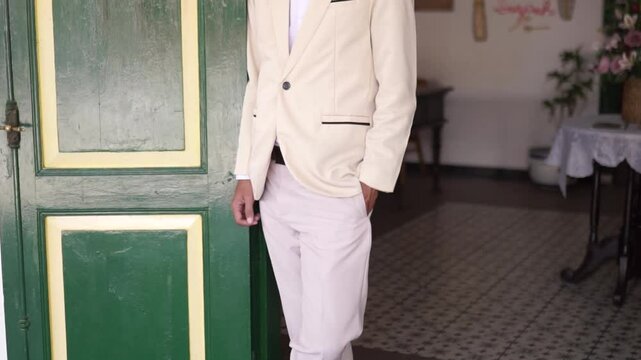 person in a suit in javanese traditional outfit for prewedding or wedding