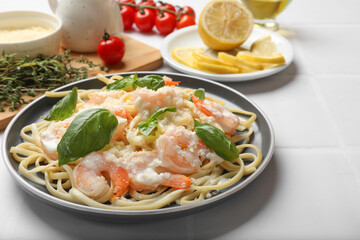 Tasty pasta with shrimps served on white table, closeup