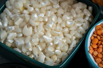 several pots with raw grains for preparing healthy food