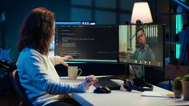 Software engineer teacher doing online tutoring, talking with student in online videocall about ways to do debugging. IT master teaching apprentice in webinar how to write code, camera A