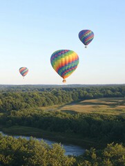Fototapeta premium Colorful Hot Air Balloons Over River and Forest Landscape