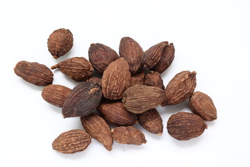 Black cardamom on white background 