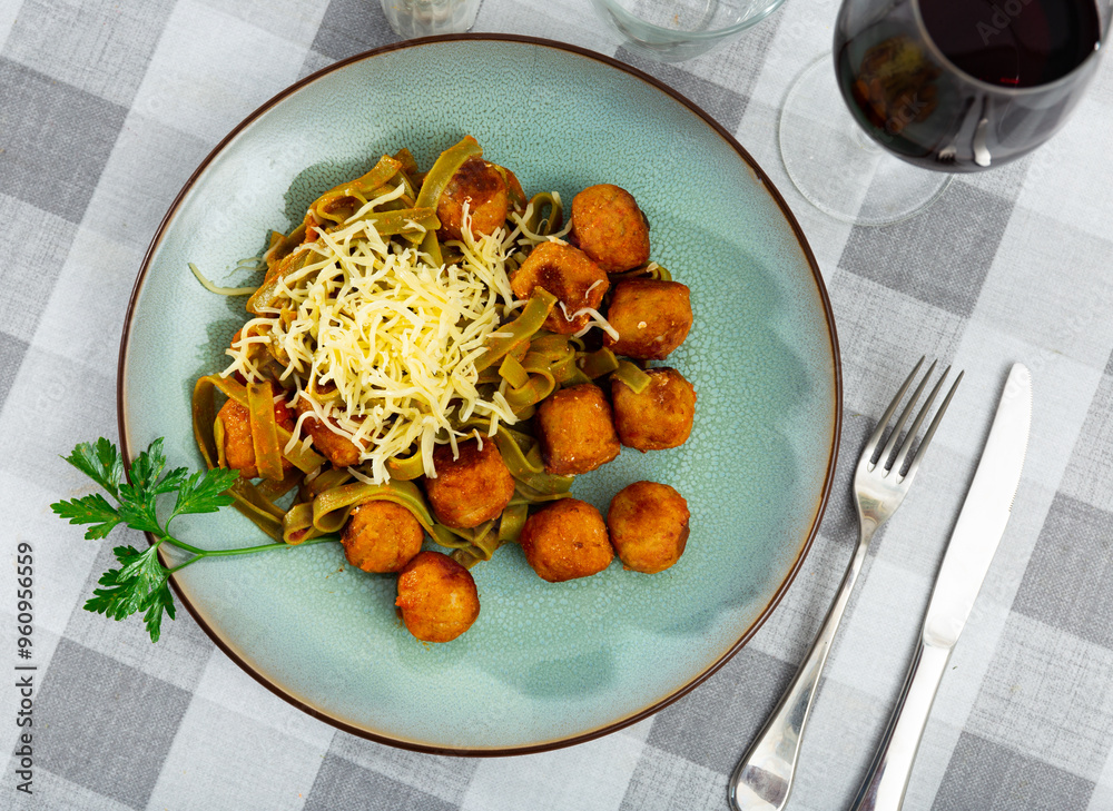 Wall mural albondigas with pasta - spanish meatballs, with ingredients: flour, onion, garlic, tomatoes