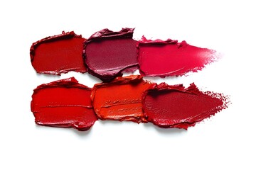 Cosmetic texture smudge red different color tones red lipstick. Swatches isolated on white