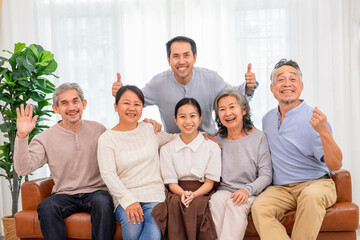 portrait of happy 3rd generations asian families in the living room at home,family lifestyle,relationship,domestic life
