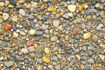 Naklejka premium A close-up view of colorful pebbles and stones, creating a natural texture perfect for backgrounds and art projects.