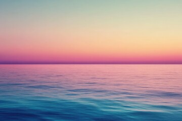 Obraz premium A serene landscape of a calm ocean at sunset, featuring soft pastel colors that create a peaceful atmosphere.